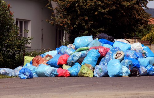 Collection crew managing curbside recycling bins in neighbourhood